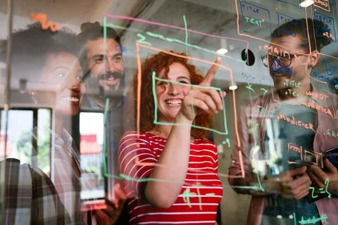 Team of programmers writing digital code in the metaverse and working together Foto stock