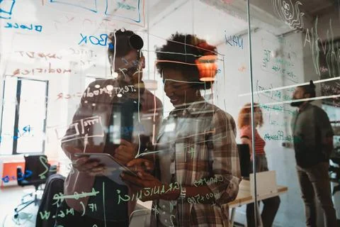 Team of programmers writing digital code in the metaverse and working together Stock-Fotos