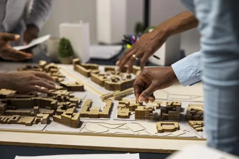 Team of real estate developers planning modern residential project Stock Photos