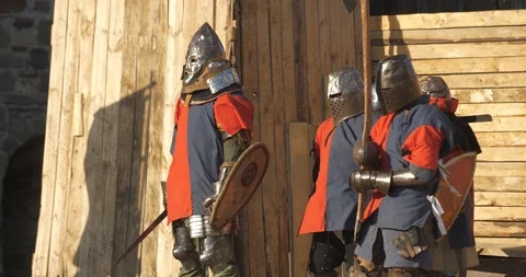 Team of red and blue plated warriors prepare to battle Stock Footage 100146550
