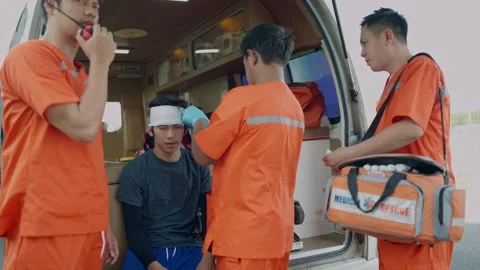 Team rescue helping to a man sustained head injury in an accident. EMS Paramedic Stock Footage 263203279