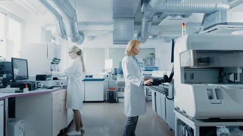 Team of Research Scientists Working On Computer, with Medical Equipment Stock Footage
