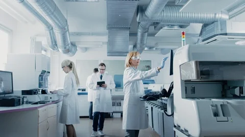 Team of Research Scientists Working On Computer, with Medical Equipment Stock Footage 97217948