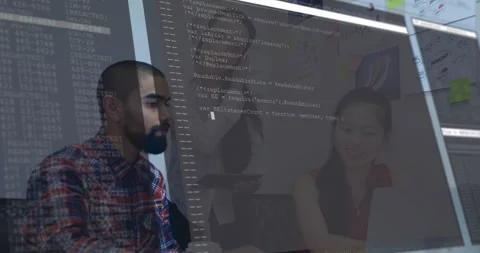 Team reviewing code in tech office, showing animated JavaScript overlay with Stock Footage 307439669