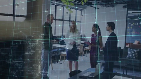 Team reviewing documents in modern office, showing animated grid overlay with Stock Footage 308602438