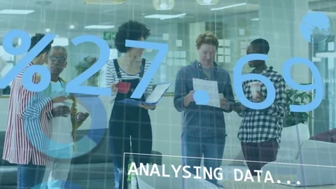 Team reviewing tablet and papers while ANALYSING DATA overlay driving tech chart Stock Footage 333670780