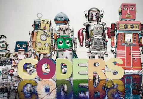 A team of robit toy coders on an old wooden floor Foto stock