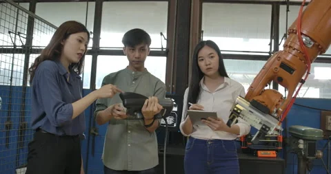 Team of Robotics Engineer Working with Robot Arm in Laboratory. Stock Footage 153050291