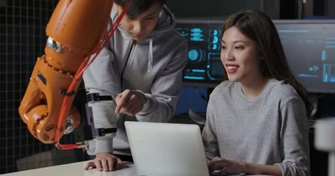Team of Robotics Engineer Working with Robot Arm in Laboratory. Stock Footage 153053545