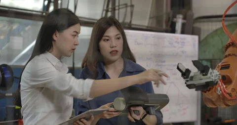 Team of Robotics Engineer Working with Robot Arm in Laboratory. Stock Footage 153069487