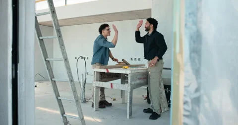 Team, roofing and high five with men on construction site for manufacturing or Stock Footage 343161652