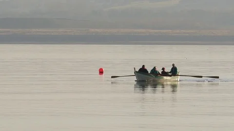 A team rowing a boat together Stock Footage 72790729