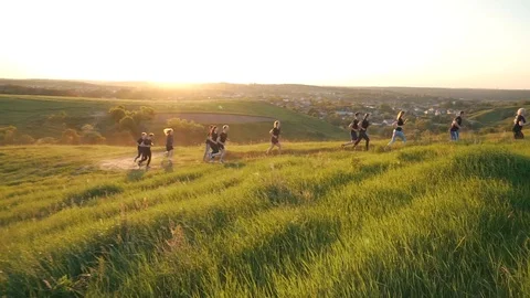 Team running outdoors in the sunlight Stock Footage 94670025