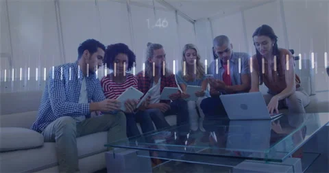 Team scanning tablets initiating data bars and line graph in business lounge, Stockbeeldmateriaal 313494024
