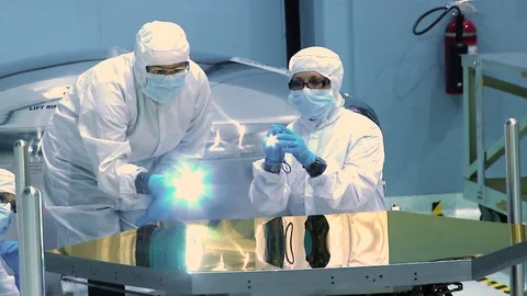 Team of scientist work on James Webb Space Telescope in space center 스톡 동영상 97700240