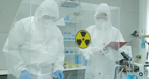Team of scientist working in a secure high level research laboratory. Stock Footage 93810030