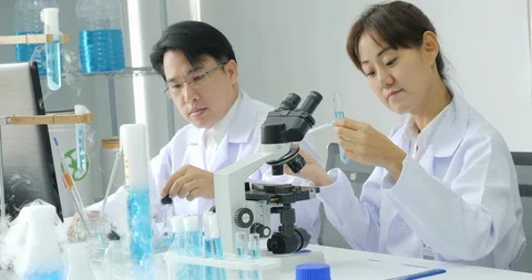 Team of scientist working in a secure high level research laboratory. Video stock 93837653
