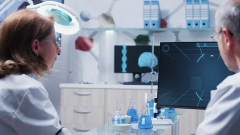 Team of scientists are analysing some advanced scan Stock Footage 111056828