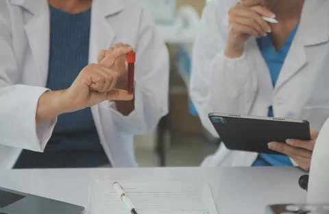 Team of Scientists Choose Between Printed Circuit Board to Work With. In Th.. Stock Photos