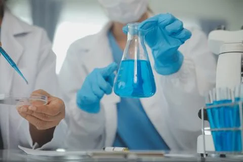 Team of Scientists Choose Between Printed Circuit Board to Work With. In Th.. Stock Photos