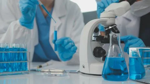 Team of Scientists Choose Between Printed Circuit Board to Work With. In Th.. Stock Photos