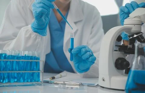 Team of Scientists Choose Between Printed Circuit Board to Work With. In Th.. Stock Photos