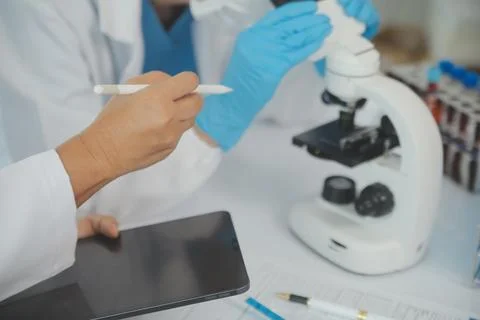 Team of Scientists Choose Between Printed Circuit Board to Work With. In Th.. Stock Photos