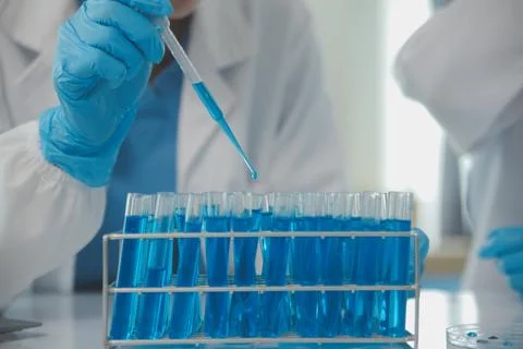 Team of Scientists Choose Between Printed Circuit Board to Work With. In Th.. Stock Photos