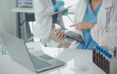 Team of Scientists Choose Between Printed Circuit Board to Work With. In Th.. Stock Photos