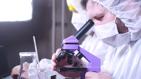 Team of scientists working in laboratory. Bio research. DNA science researcher. 動画素材 122761666