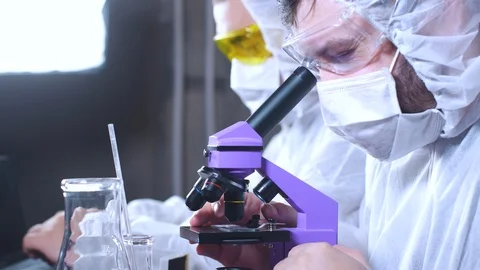 Team of scientists working in laboratory. Bio research. DNA science researcher. Stock Footage