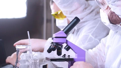 Team of scientists working in laboratory. Bio research. DNA science researcher. Stock-Footage 122761820