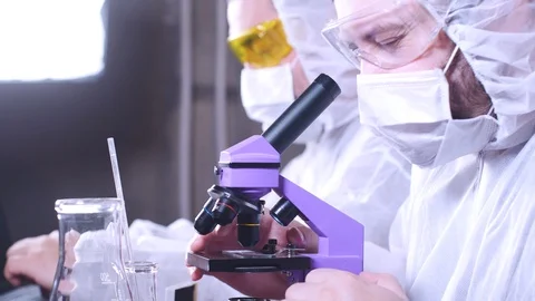Team of scientists working in laboratory. Bio research. DNA science researcher. Stock-Footage 122761958