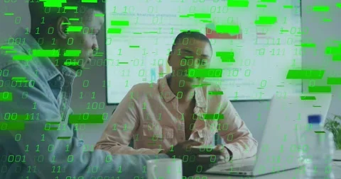 Team scrolling charts on PC in data analysis meeting while green binary code Stock Footage 317800076