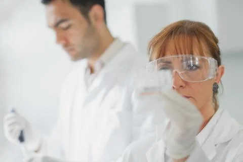 Team of serious scientists at work Stock Photos
