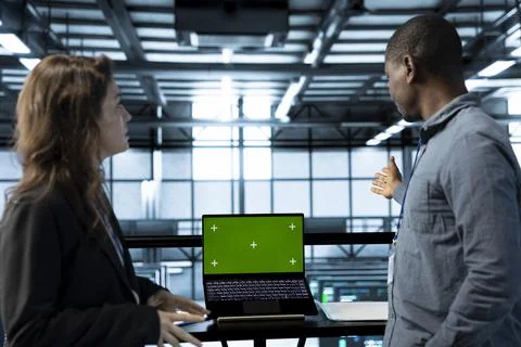 Team of server farm engineers using isolated screen mockup laptop 写真素材