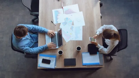 Team sitting at the desk with documents Stock Footage 103101283