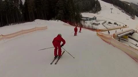 Team of skiers coming down the ski run in Bukovel, Ukraine Stock Footage 48597162