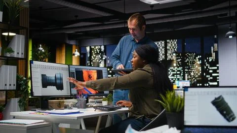 Team of skilled engineers creating Mars based virtual station using turbine Stock Photos