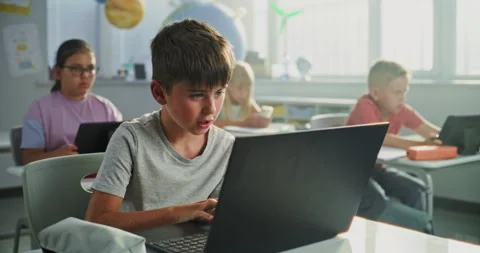 Team of Smart Diverse Kids Working on Their Laptops and Tablet Computers Stock Footage 317159054