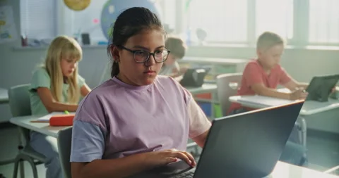 Team of Smart Diverse Kids Working on Their Laptops and Tablet Computers Stock Footage 317166099