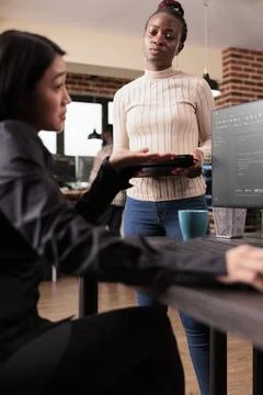 Team of software developers analyzing html code Stock Photos