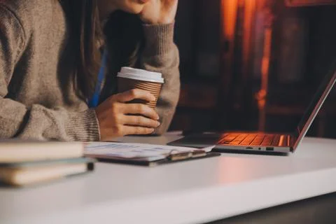 Team of software developers working on big project late at night in neon li.. 库存照片
