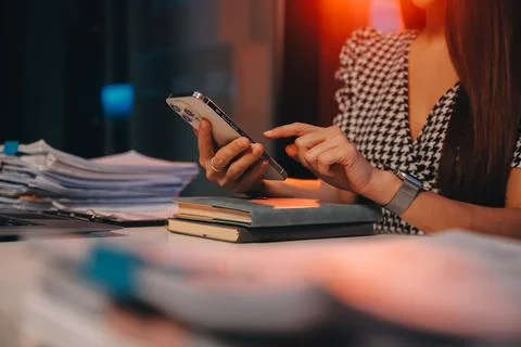 Team of software developers working on big project late at night in neon li.. 库存照片