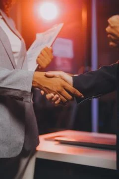 Team of software developers working on big project late at night in neon li.. 库存照片