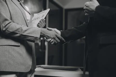 Team of software developers working on big project late at night in neon li.. 库存照片