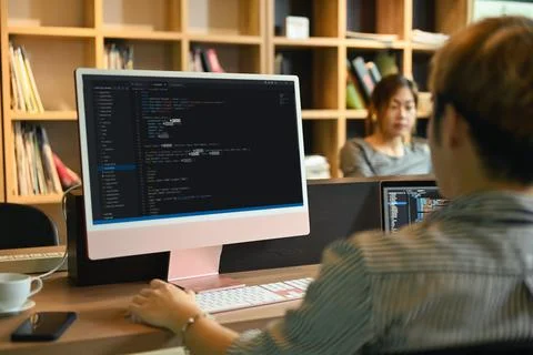 Team of software development brainstorming, working with coded data in corporate 스톡 사진