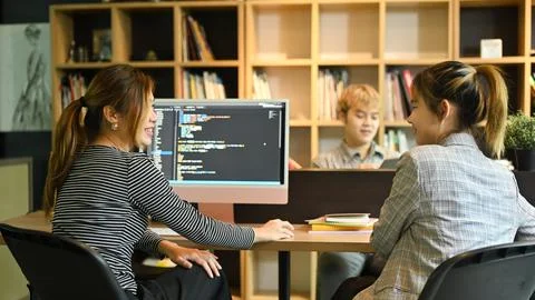 Team of software development brainstorming, working with coded data in corporate 스톡 사진