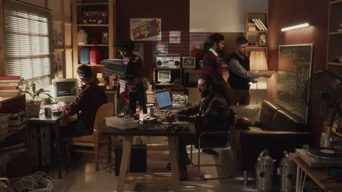 Team of Software Engineers Interacting in Dim Room Stock Footage 263297216