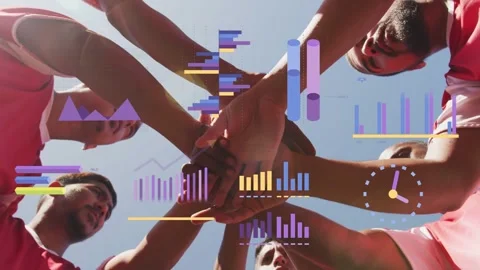 Team stacking hands under sun, showing sports overlays: charts and gauge above Stock Footage 333894323